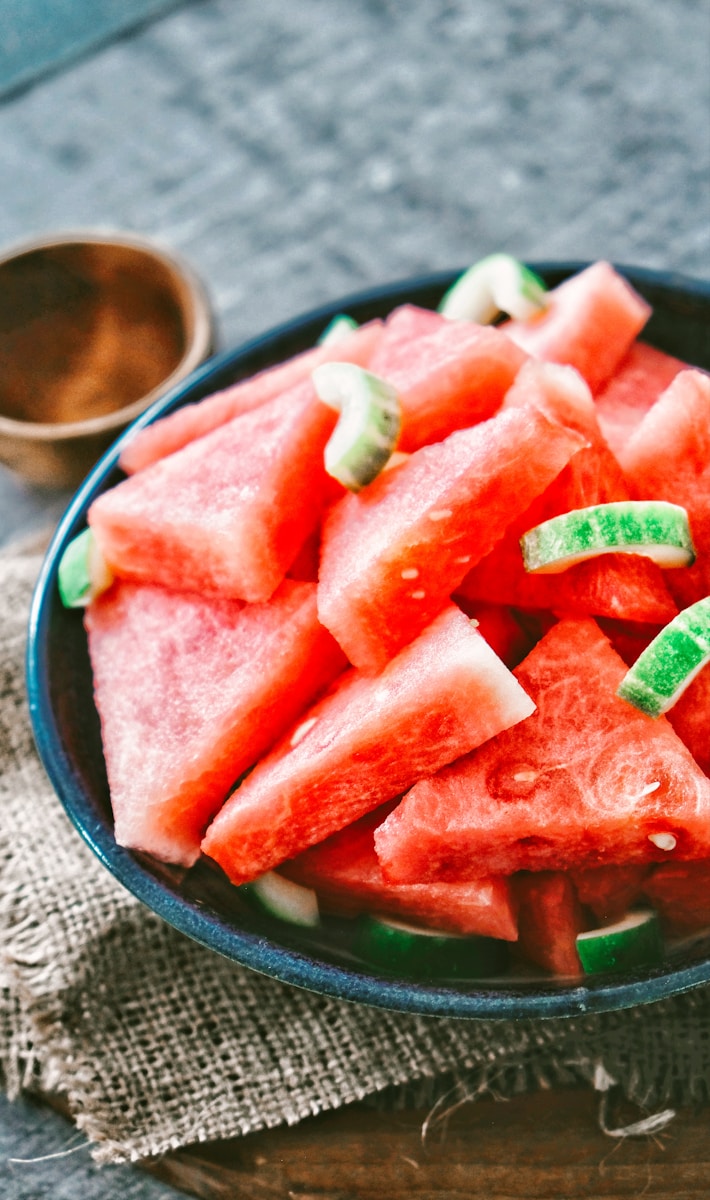 Healthy carbohydrates sliced watermelon on black round plate