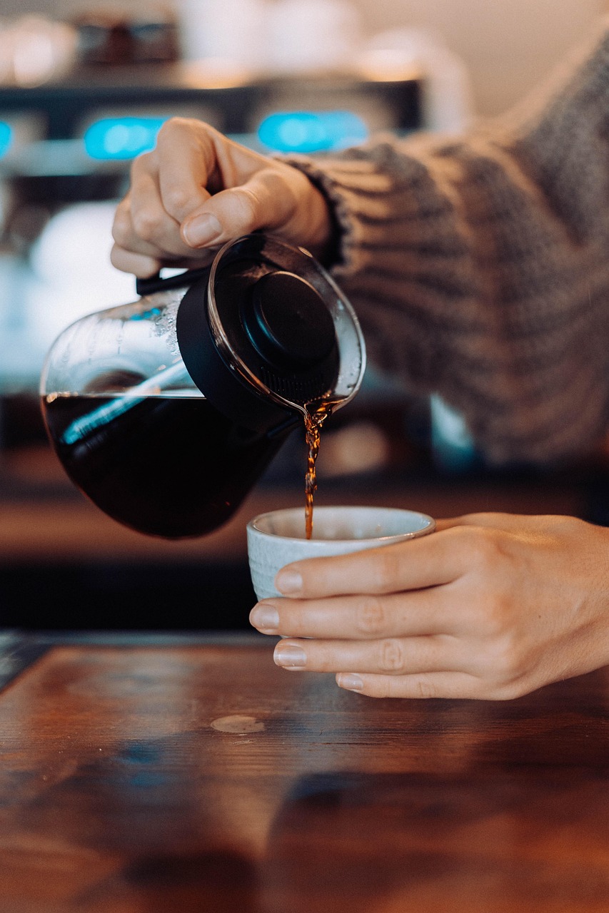 PCOS and coffee coffee, pot, cup, hands, pour, pouring, pouring coffee, black coffee, brewed coffee, freshly brewed, brew coffee, coffee cup, arabica, cafe