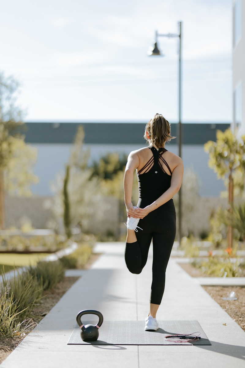 Sleep-Stress cycle a woman is doing exercises on a yoga mat