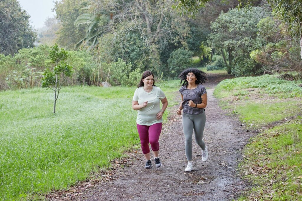 Health tests for women to stay healthy a couple of women running down a dirt road