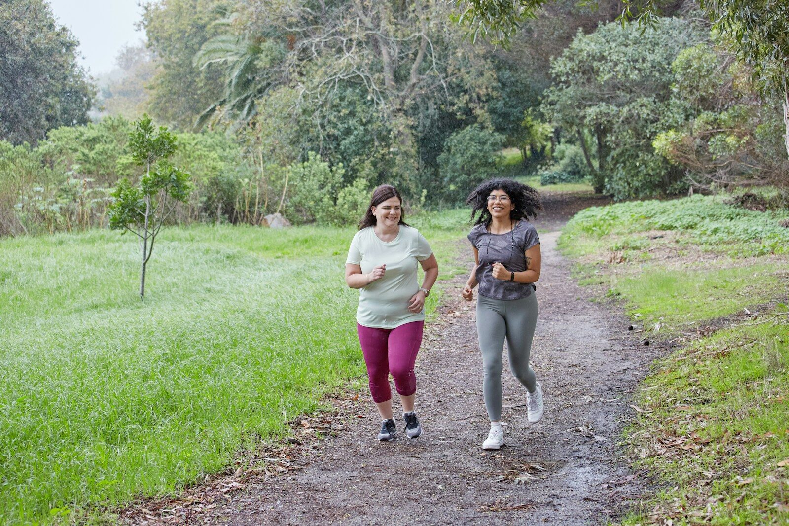 Health tests for women to stay healthy a couple of women running down a dirt road