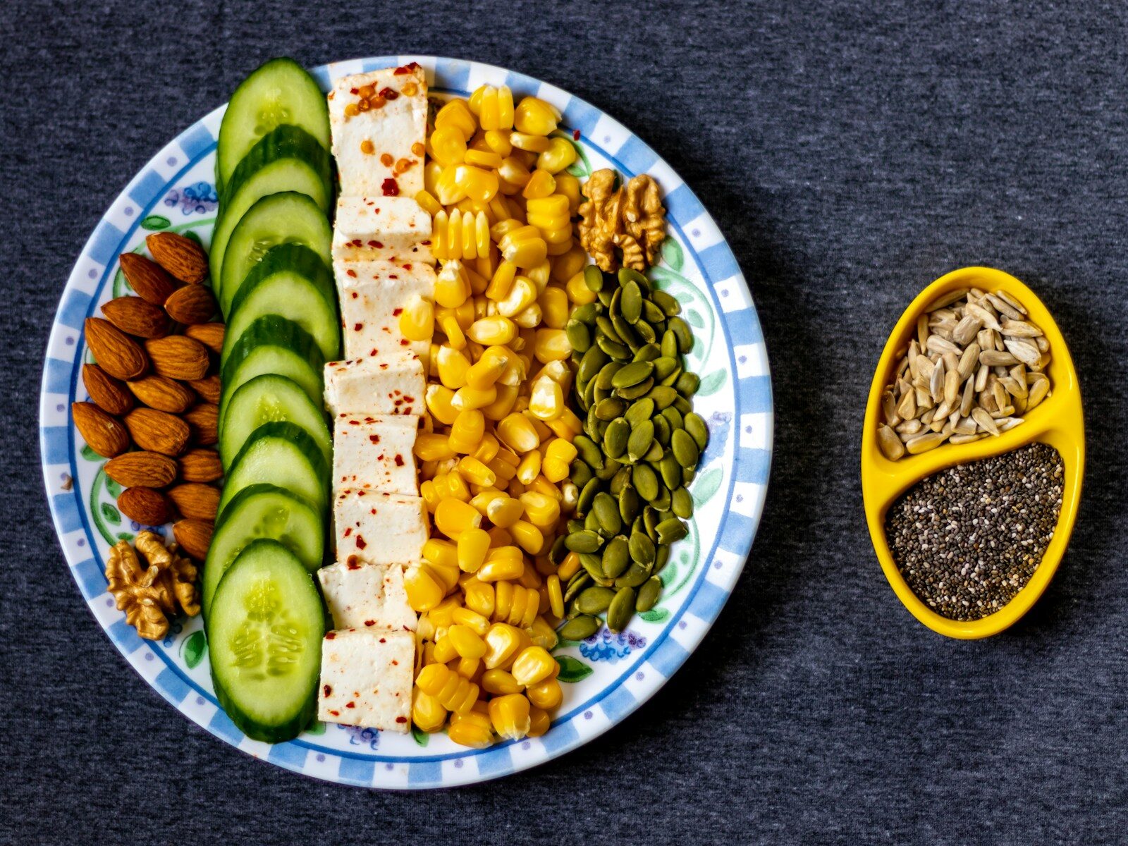 Protein in our diet sliced cucumber on white and blue ceramic plate